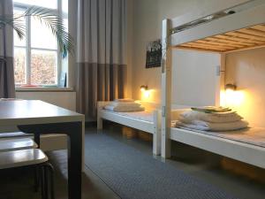 מיטה או מיטות בחדר ב-Hostel Suomenlinna