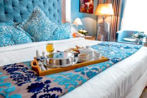 Cama ou camas em um quarto em Marina Byblos Hotel