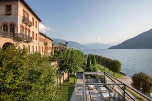 an aerial view of a building and a body of water at Villa Maria Hotel in Cannobio