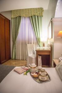 a tray of food on a table in a hotel room at Palmed Hotel in Gizzeria