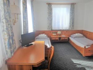 Voodi või voodid majutusasutuse Bodenseehotel Lindau toas