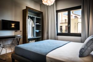 Gulta vai gultas numurā naktsmītnē Teku Sardinia Boutique Hotel