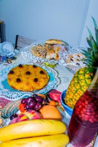 a table topped with lots of different types of fruit at Piana delle Galee in Scilla