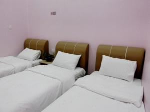 Taiping Cozy Homestay II房間的床