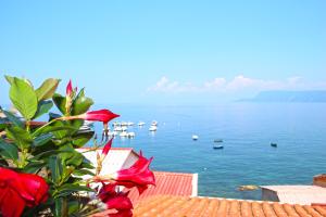 a view of the ocean with boats in the water at Piana delle Galee in Scilla