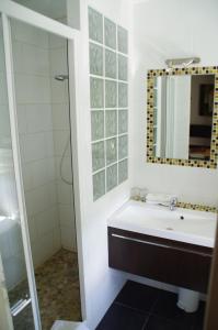 a bathroom with a sink and a mirror at Hotel Esplanade in Strasbourg