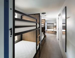 a hallway with bunk beds in a dorm room at Generator Miami in Miami Beach