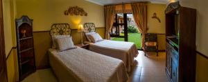 Cama ou camas em um quarto em Hostal Villa Toscana