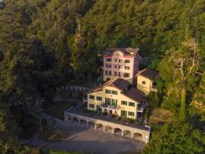 an aerial view of a large house on a hill at Relais Casali della Cisterna in Belgirate