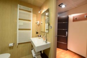 a bathroom with a sink and a mirror at Hotel Guglielmo in Catanzaro