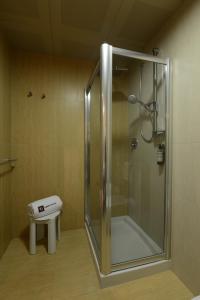 a shower with a glass door in a bathroom at Hotel Guglielmo in Catanzaro