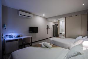 The Leverage Business hotel (Skudai) 객실 침대