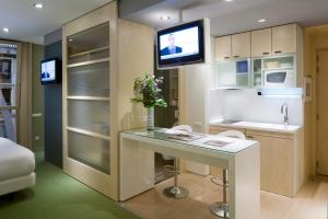 A kitchen or kitchenette at Ako Suites Hotel