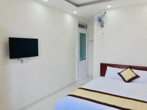 Giường trong phòng chung tại Mai Ngoc Hotel