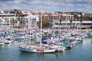 a bunch of boats are docked in a harbor at Hotel Marina Rio in Lagos