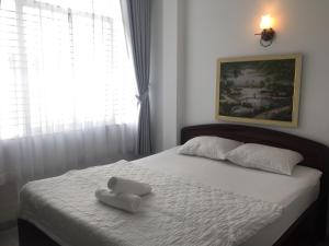 Lova arba lovos apgyvendinimo įstaigoje Vy Khanh Guesthouse