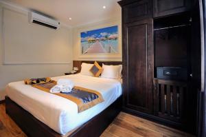 Ліжко або ліжка в номері Apollo Hotel Nha Trang Beach