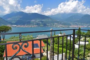 a balcony with a view of a lake and mountains at Albergo Ristorante Conca Azzurra in Colico