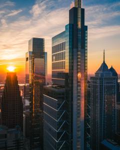 a group of skyscrapers in a city at sunset at Four Seasons Hotel Philadelphia at Comcast Center in Philadelphia