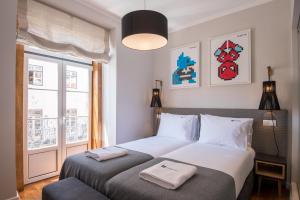 Una cama o camas en una habitación de Urbano FLH Hotels Lisboa