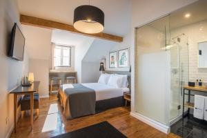 Una cama o camas en una habitación de Urbano FLH Hotels Lisboa