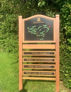 a sign for the hollins trail at a park at Hollins Hall Hotel, Golf & Country Club in Bradford