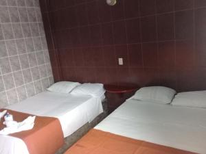 Una cama o camas en una habitación de Hotel Naj Kin