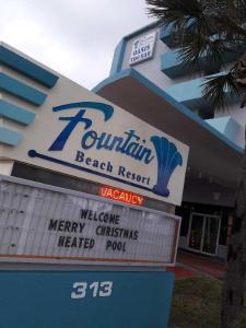 a building with a sign for a beach resort at Fountain Beach Resort - Daytona Beach in Daytona Beach