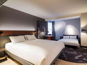 Ένα ή περισσότερα κρεβάτια σε δωμάτιο στο Mercure Amsterdam City Hotel