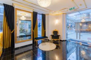 a room with a table and chairs and a window at Hotel LX Rossio in Lisbon