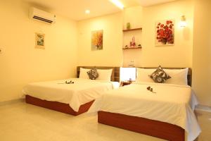 Tempat tidur dalam kamar di Lam Garden Boutique Homestay