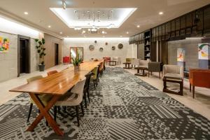 a large dining room with a long table and chairs at Hotel Gran Ms Kyoto in Kyoto