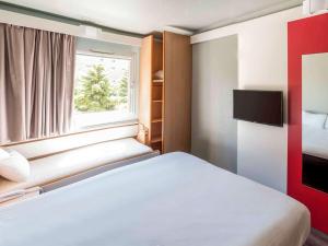 เตียงในห้องที่ Ibis Salamanca