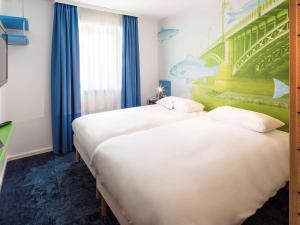 Voodi või voodid majutusasutuse ibis Styles Strasbourg Avenue du Rhin toas