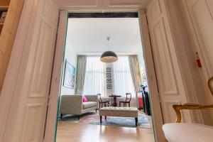 a hallway with a living room and a dining room at B&B Blossom in Amsterdam