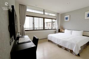 Vuode tai vuoteita majoituspaikassa Talmud Hotel Taichung