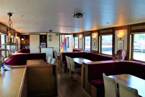 a dining car of a train with tables and chairs at Felicitas in Amsterdam