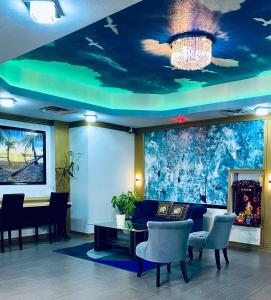 a lobby with a ceiling with a painting of a ceiling at R Nite Star Inn and Suites -Home of the Cowboys & Rangers in Arlington