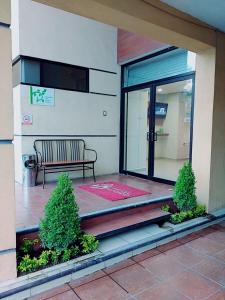 a bench sitting outside of a building at Hotel Madrid in Tuxtla Gutiérrez