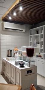 a kitchen with a counter with dishes on it at Hotel Madrid in Tuxtla Gutiérrez