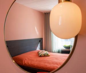 Säng eller sängar i ett rum på Staykvick Boutique Hostel