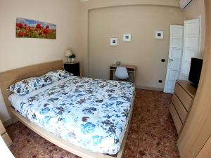 a bedroom with a bed and a television in it at La Casa di Aurora in Reggio di Calabria