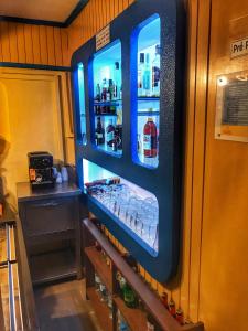 a refrigerator with its doors open in a kitchen at Pensao Residencial Flor dos Cavaleiros in Lisbon