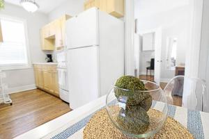 a glass vase sitting on a table in a kitchen at Dallas Native, Lower-Greenville Ave Area in Dallas