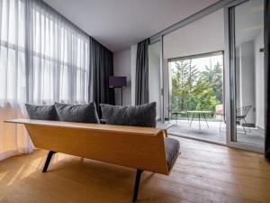 a living room with a couch and a large window at Galeria Plaza San Jeronimo in Mexico City