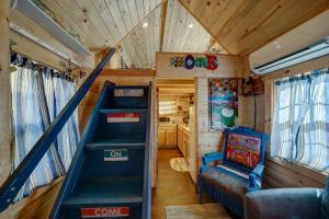 an interior of a tiny house with stairs and a play room at Tiny House Leadville Colorado in Leadville