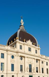 a building with a cross on top of it at InterContinental Lyon - Hotel Dieu, an IHG Hotel in Lyon