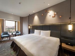 Кровать или кровати в номере The Howard Prince Hotel Taichung