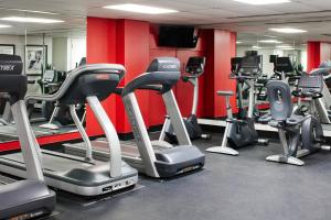 a gym with rows of treadmills and cardio machines at Club Quarters Hotel Rittenhouse Square, Philadelphia in Philadelphia