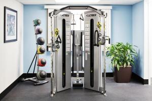 a gym with two rows of tread machines at Club Quarters Hotel Rittenhouse Square, Philadelphia in Philadelphia